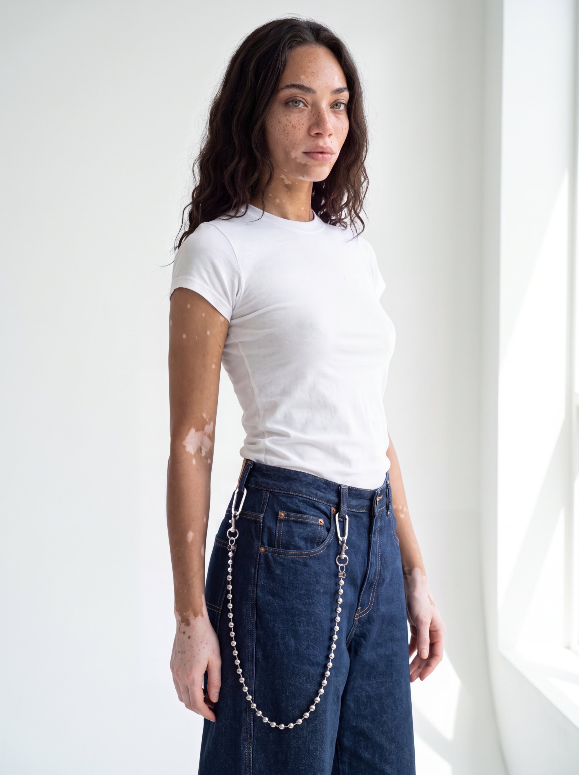 Our fixed model in a white tee and dark jeans wearing the Line 47 chain